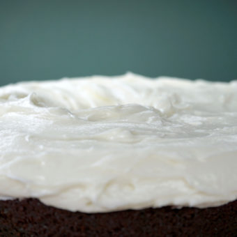 Cream cheese frosting atop Guinness chocolate cake